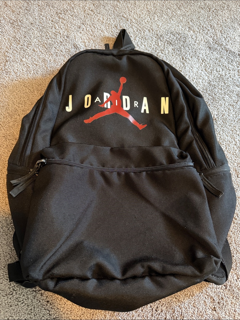 Black Jordan Backpack with Red Jumpman and White Lettering